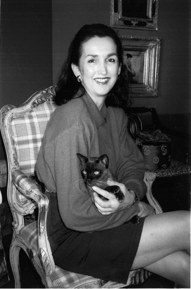 Alexandra Mckenzie with Coco the cat, interior decor business No. 78 Queen Street, Woollahra, 1994. Woollahra Libraries Digital Archive, pf008348.